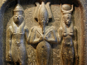 The Egyptian "trinity" of Horus (the hawk-headed god of the sky, personification of the living Pharaoh), Osiris (the dead god of the underworld, personification of the mummified and dead Pharaohs), and Isis (the protector goddess). In order - son, husband, wife.